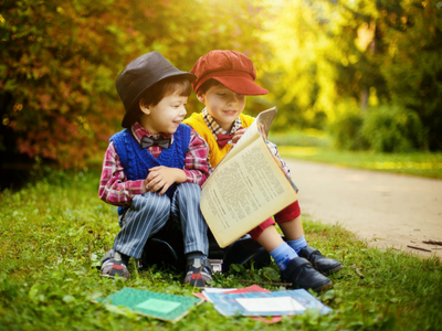 Kids reading outside